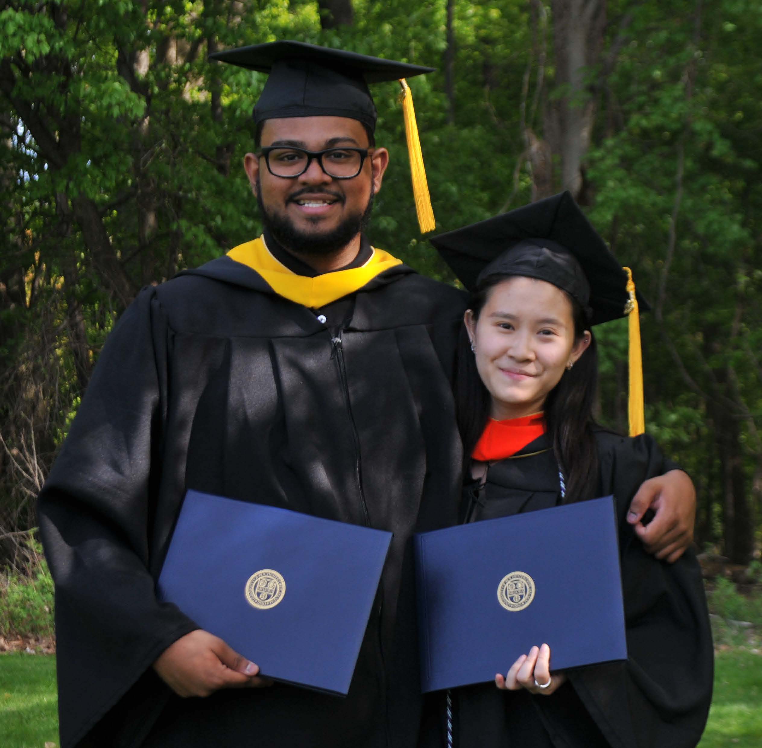 2 students w/ diplomas