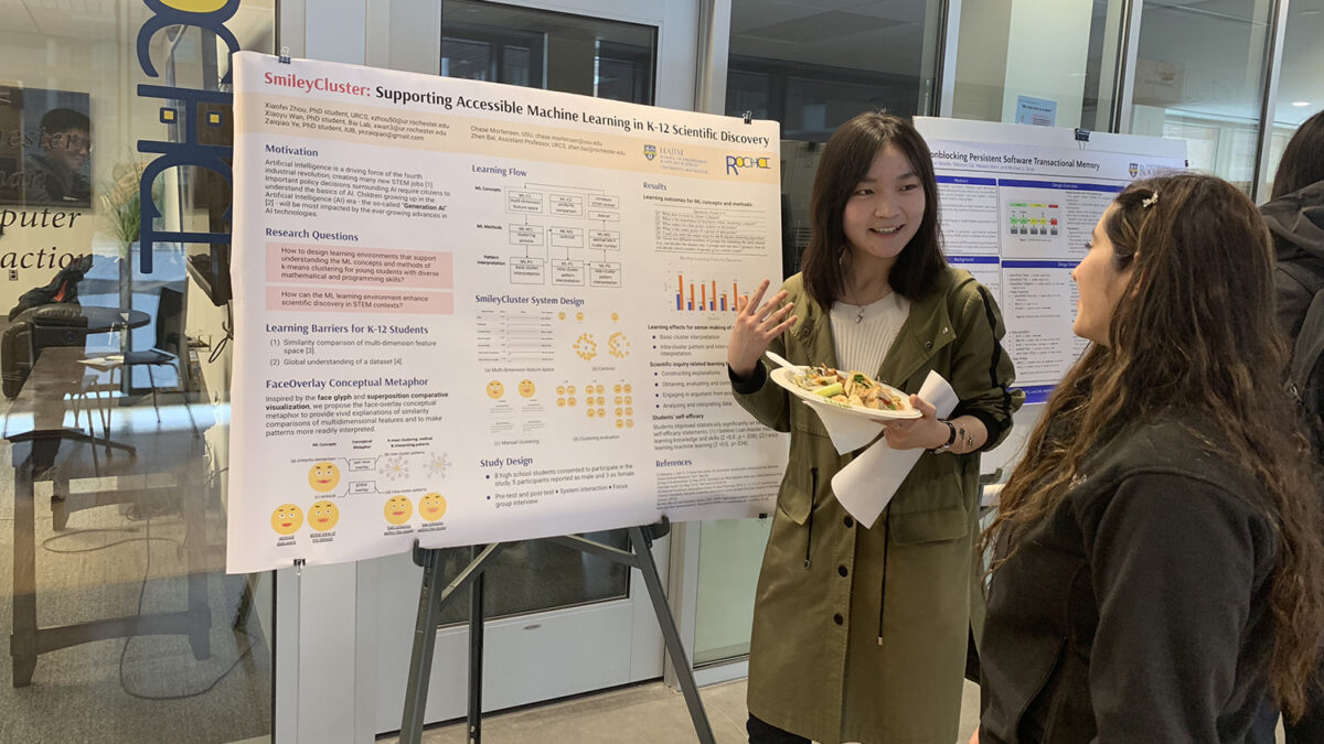 PhD student Xiaofei Zhou discussing her research poster
