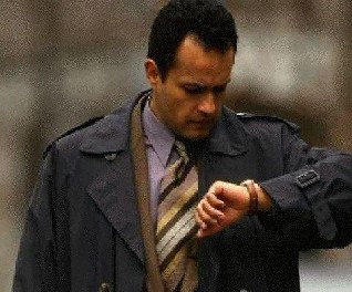 man looking at his watch