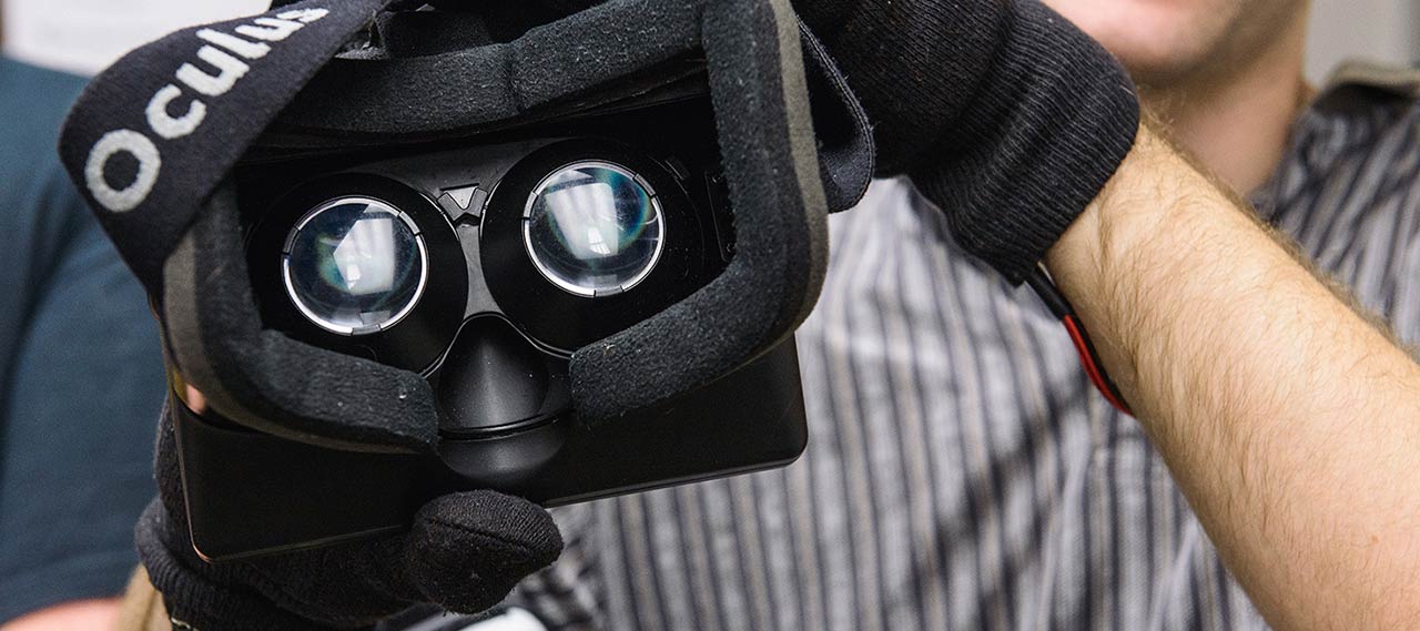 Person holding oculus headset